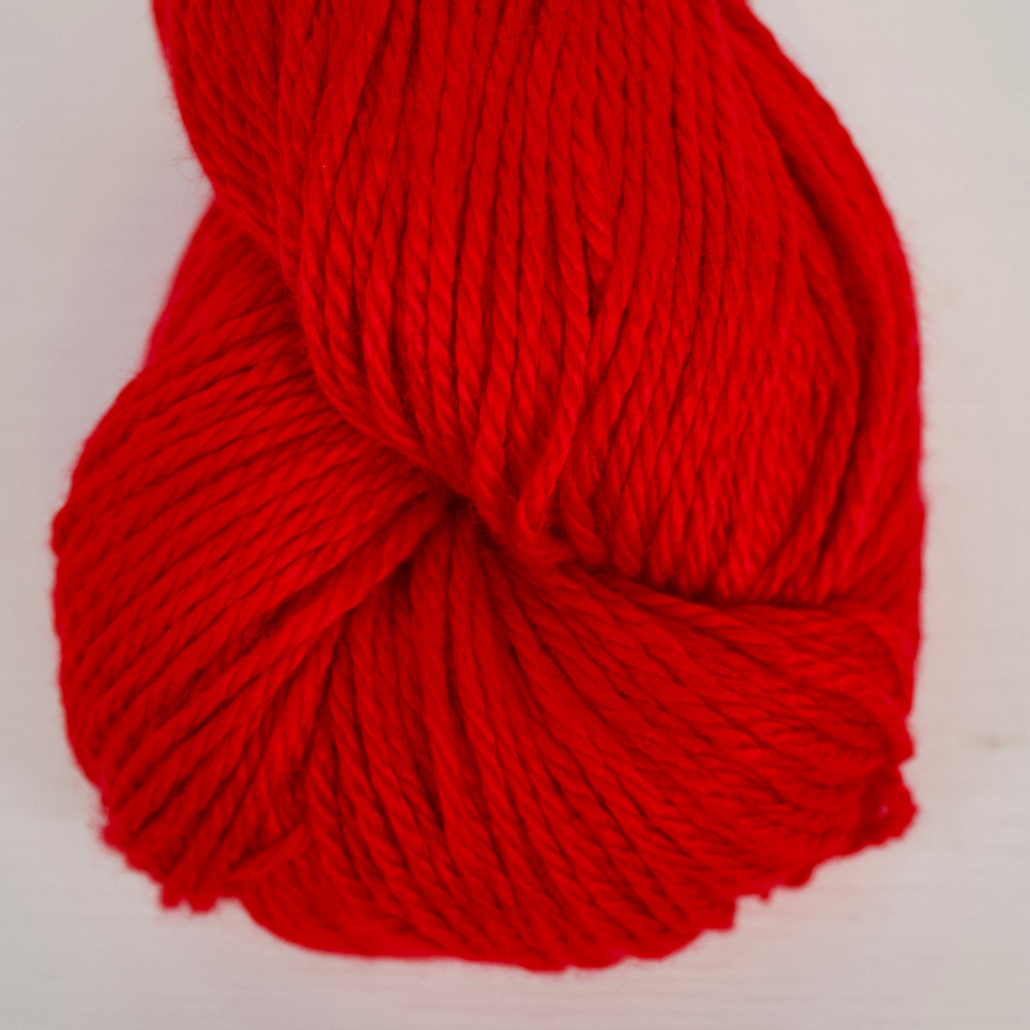 Vegan Yarn - Alnilam - Firecracker is an intense, classic red, only slightly semisolid for some visual texture.