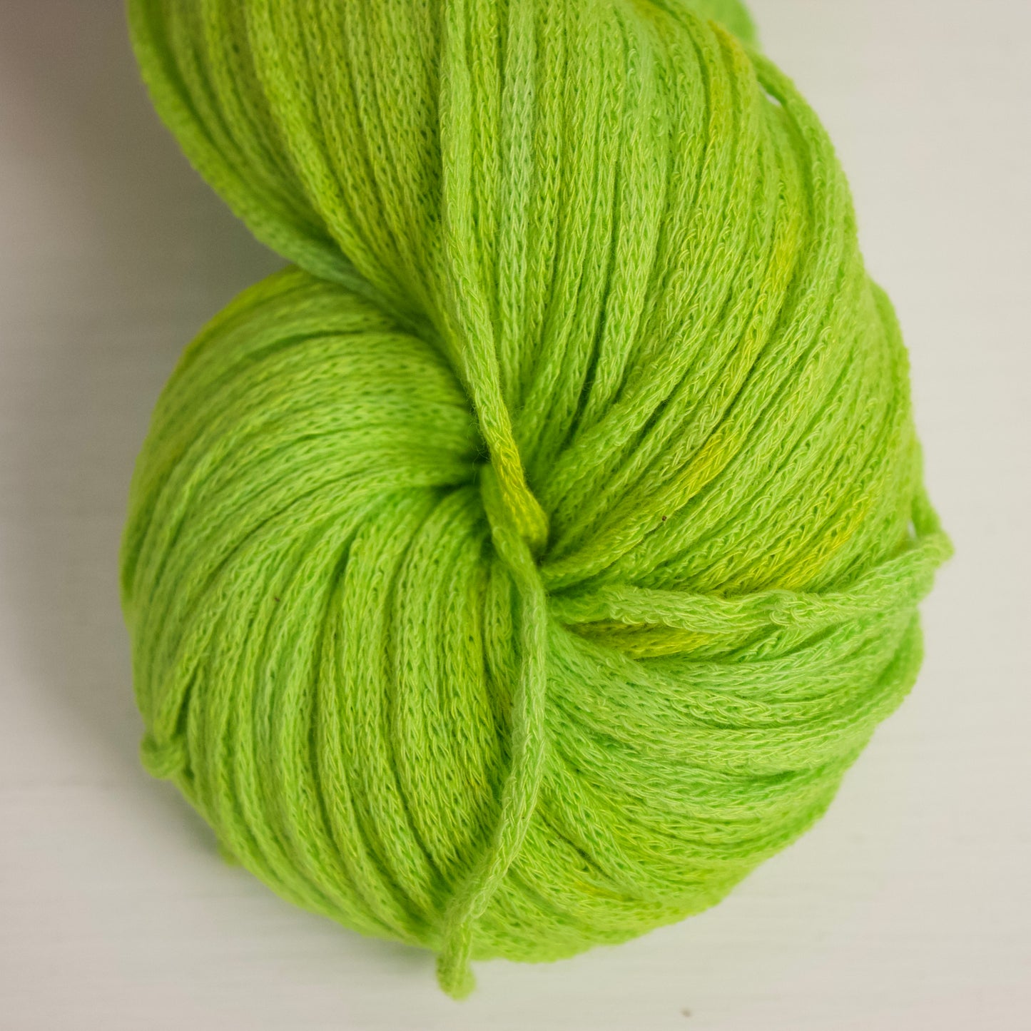 Intensely neon green yarn with highlights of brigt yellow. 