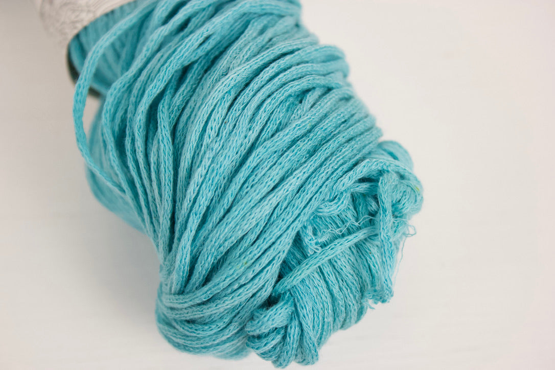 Close up of Taika Aqua, an all over bright aqua colour that's slightly semisolid which gives it some texture.